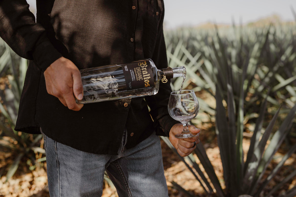 Man pouring Braltos tequila into a glass.